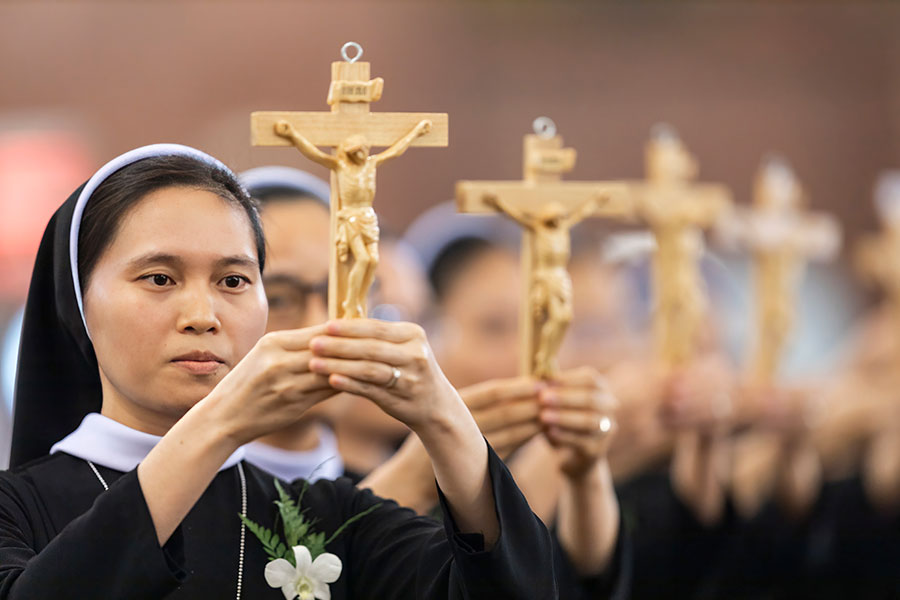 Nine members of the Lovers of the Holy Cross of Vinh made their perpetual profession of vows on August 9 at a Mass celebrated by Bishop Michael Olson at Vietnamese Martyrs Church in Arlington. (NTC/Juan Guajardo)